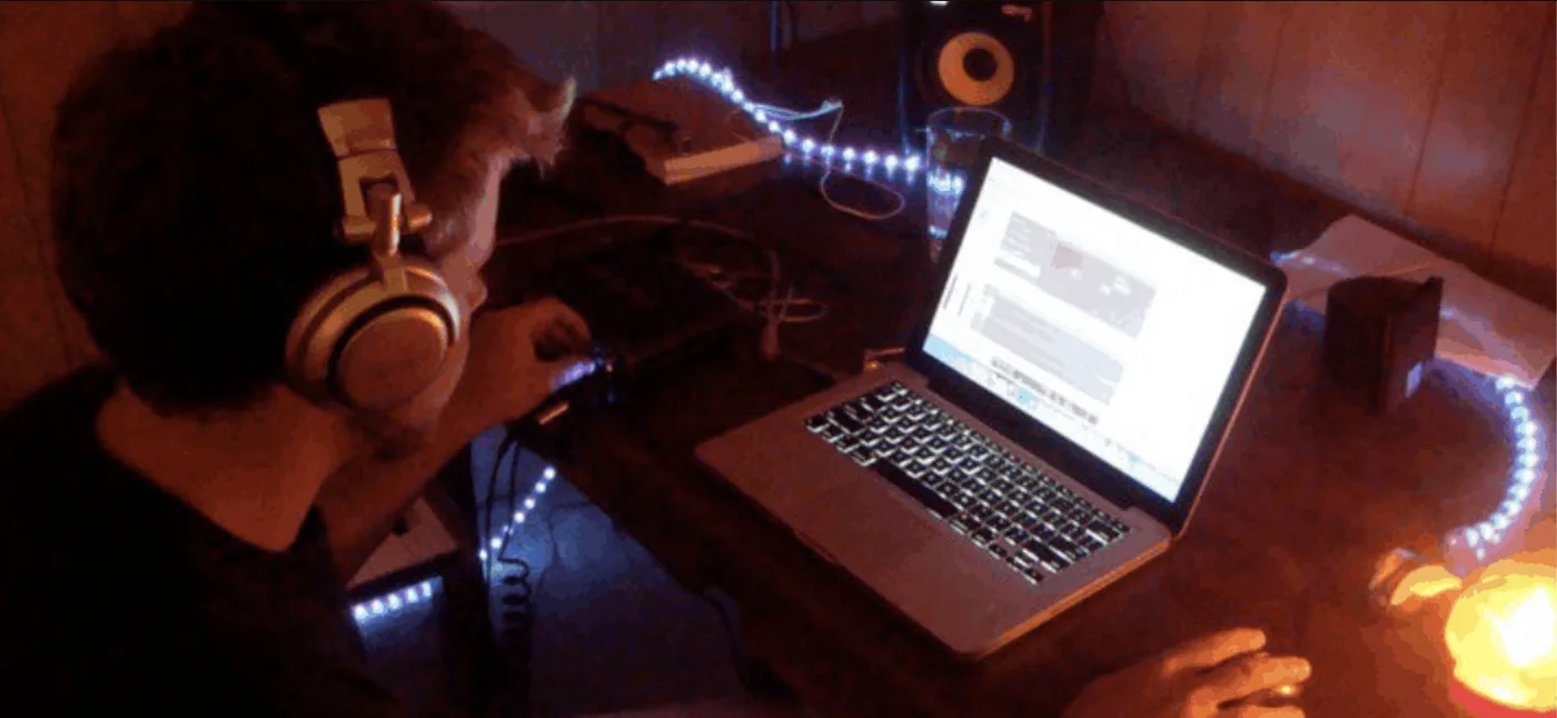 Serik's first studio setup: a laptop, LED strips, and a dream