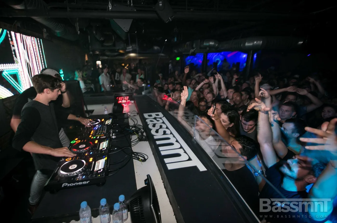 FOMO behind the Pioneer decks at Bassmnt with a packed crowd pressed up to the booth