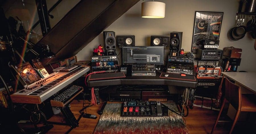 Under-staircase home studio, creative use of space with carpet dampening