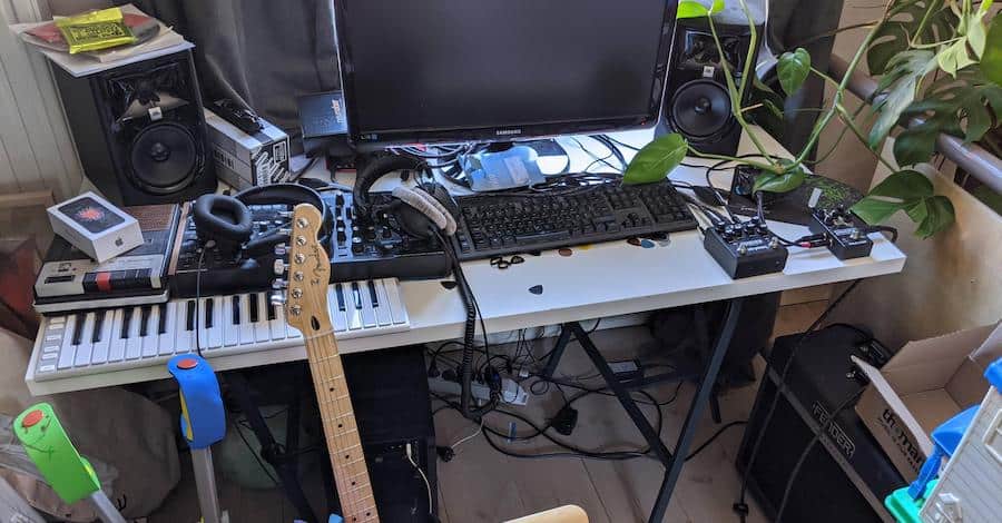 Imgur messy studio, plants, boxes, wiring, instruments, headphones and an iPhone box for good measure