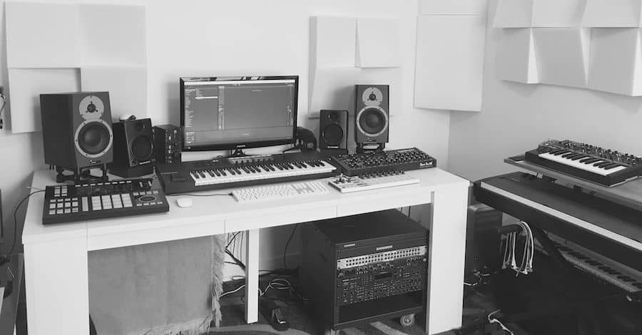 Twitter minimal studio, Skumacoustics panels and Isoacoustics stands in a tech-inspired setup