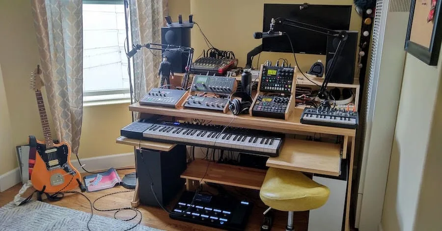 Imgur small studio, functional setup with angled wall and wall-mounted monitor with Rode swivel stand