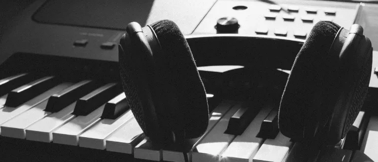 Studio headphones resting on a keyboard