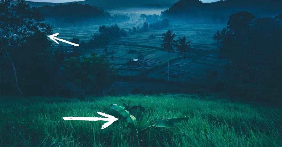 Misty mountain landscape where gradient fog creates an impression of movement and depth, with layers receding into the distance