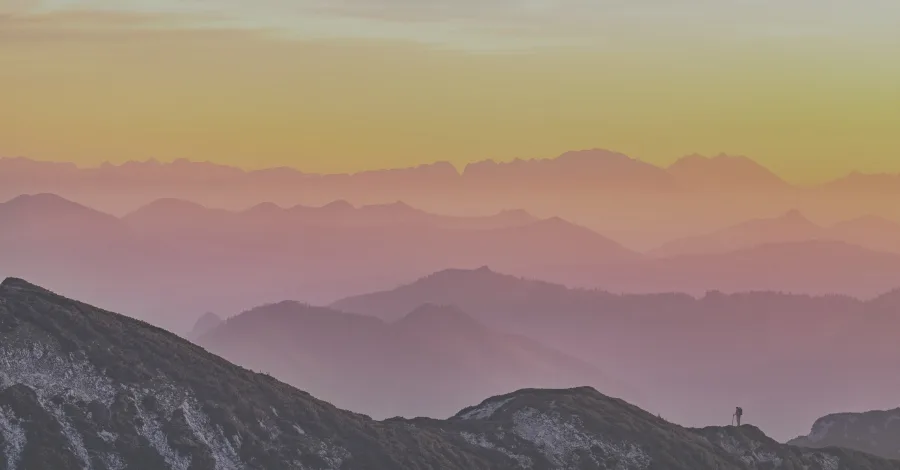 Abstract colorful landscape with warm bright tones contrasting against deep cool shadows, representing tonal coloration in a mix