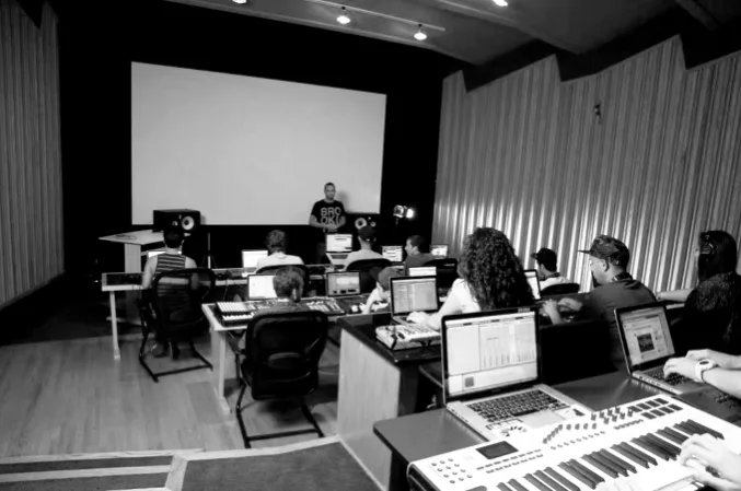 Online music education setup with a laptop and production equipment