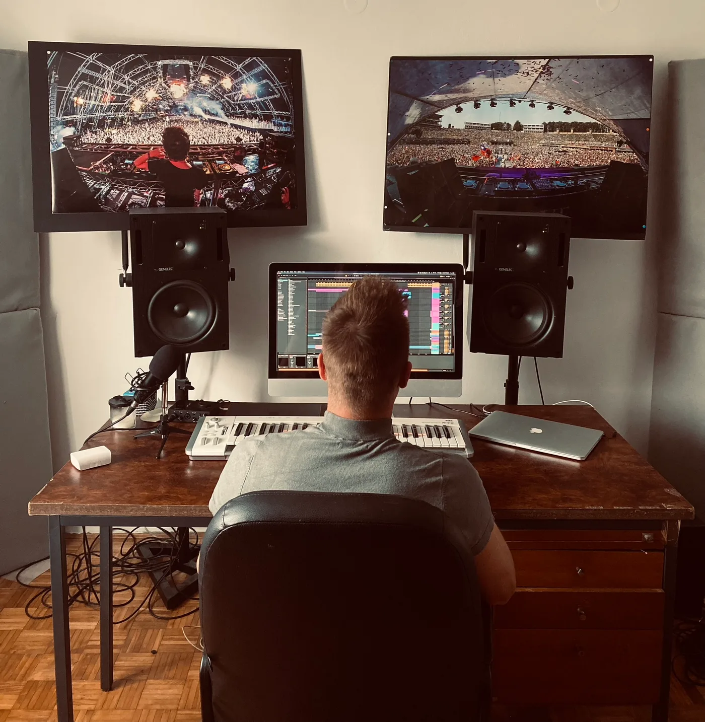 Ortox at his studio desk working in a DAW between dual monitors and a MIDI keyboard