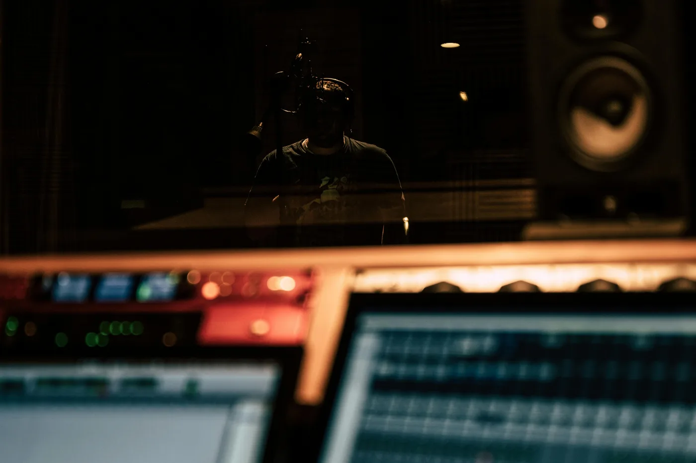 Music producer working on de essing in a home studio