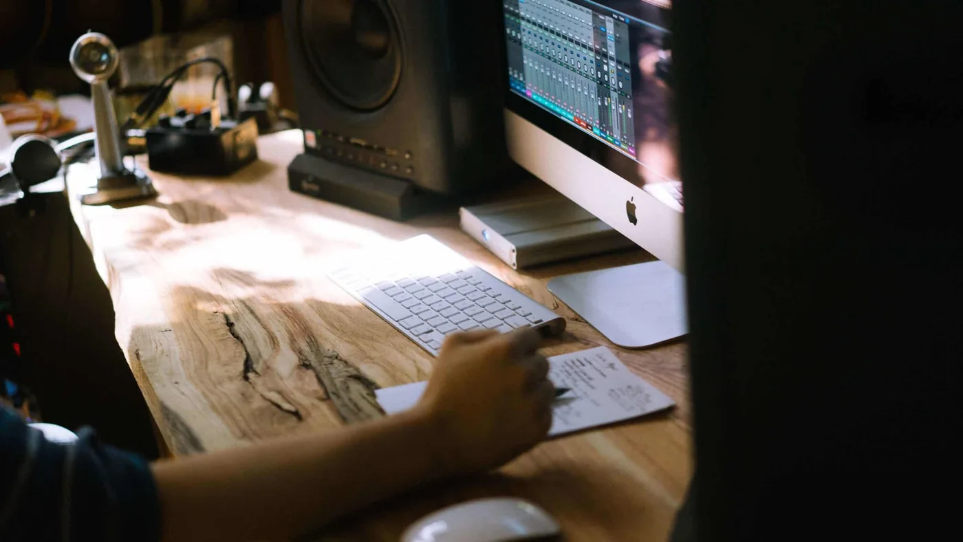Studio session with multiple reference tracks loaded in a DAW