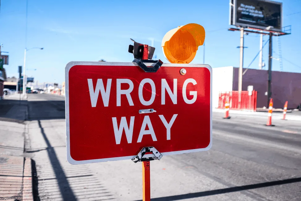 Wrong way sign on a road, representing lack of direction