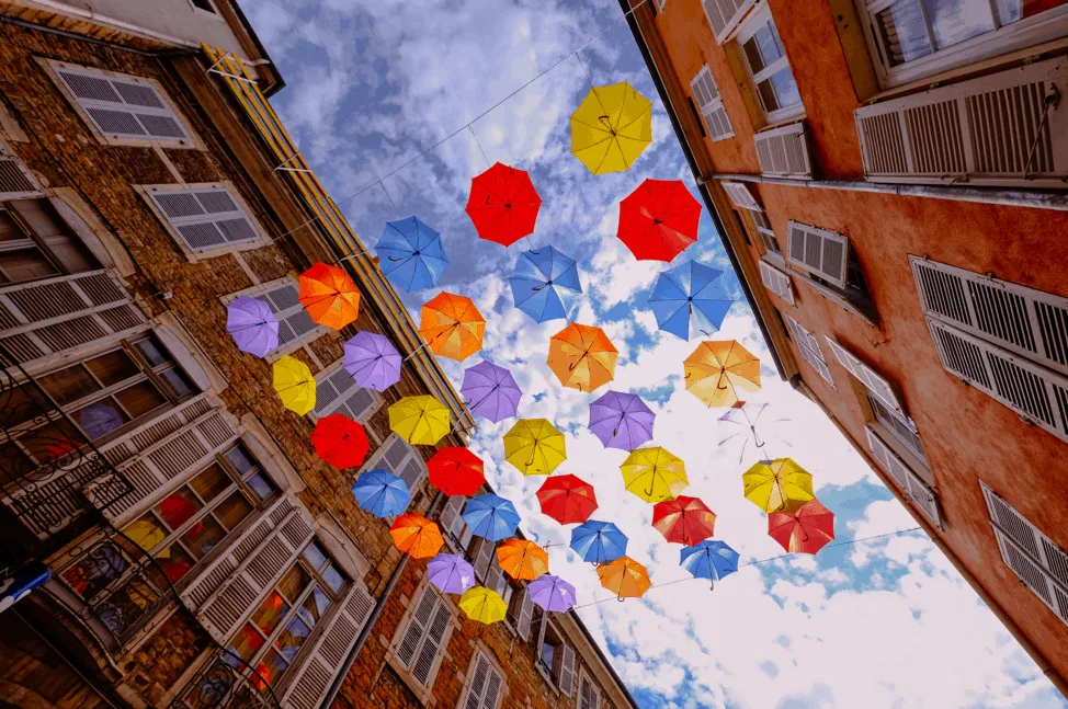 Colorful umbrellas seen from below, representing the overwhelming flood of information